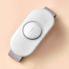 White electronic device with gray straps on a beige background