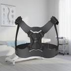 Black chest harness on a light gray background