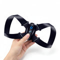 Black butterfly-shaped device with a blue power symbol and digital display on a white background
