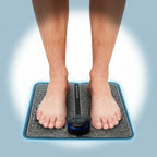 Person using a vibration mat with digital display on a tiled floor